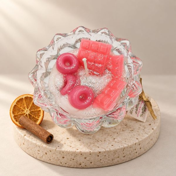 Scented Candle in jar with cinnamon and orange with pink donuts